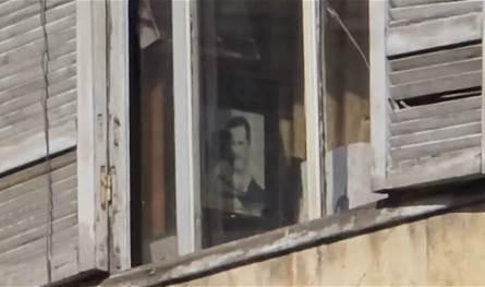 صورة لـ بشار الأسد داخل مبنى حكومي تُثير احتجاجات في حلب… ما القصة؟