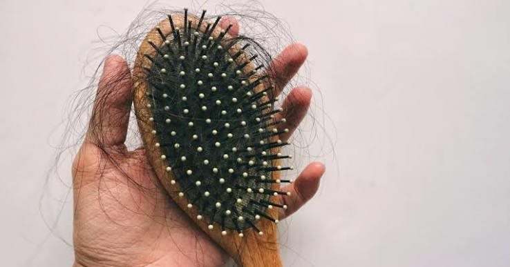 Why should you clean your hairbrush regularly?
